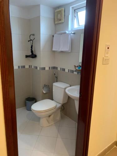 a bathroom with a toilet and a sink at Hotel Love - 315 Đ. Hoàng Mai - by Bay Luxury in Hanoi