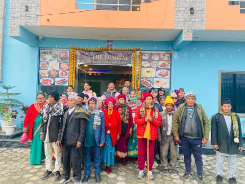 a group of people standing in front of a building at The Lumbini Hotel in Lumbini