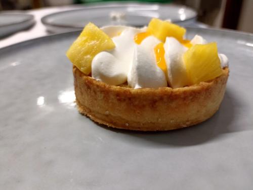 a piece of pie with cheese and fruit on a plate at La Belle Tortue in Silhouette Island