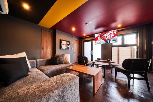 a living room with a couch and a table at Rakuten STAY x EAGLES in Sendai