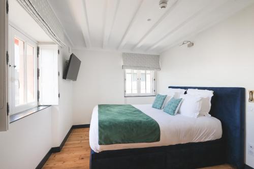 a bedroom with a large bed in a white room at MADISON Saint Jean de Luz - Handwritten Collection in Saint-Jean-de-Luz
