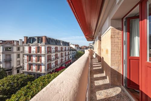 a balcony with a view of buildings at MADISON Saint Jean de Luz - Handwritten Collection in Saint-Jean-de-Luz