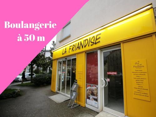 a yellow building with a sign in front of it at Vue Montagne - Appt Cosy et calme - Netflix - Fibre in Grenoble