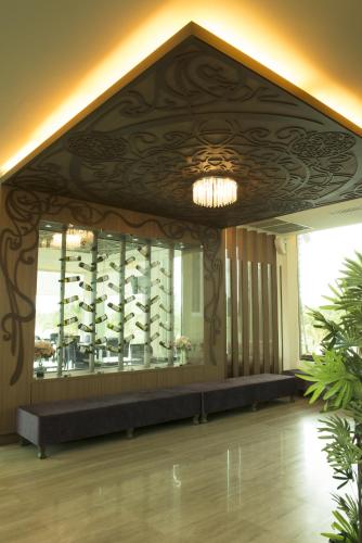 a large room with a wall of wine bottles at The Beverly Hills Hotel in Nakhon Ratchasima