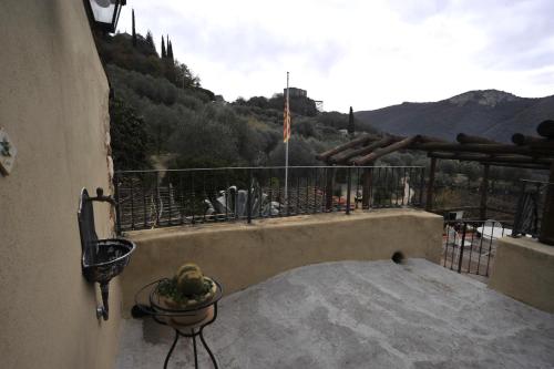 a balcony with a view of a mountain at Agriturismo La Contessa in Finale Ligure