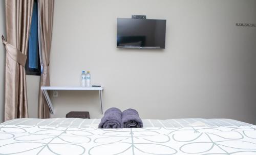 Ένα ή περισσότερα κρεβάτια σε δωμάτιο στο Saba Ayu Guest House
