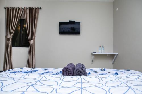 Ένα ή περισσότερα κρεβάτια σε δωμάτιο στο Saba Ayu Guest House