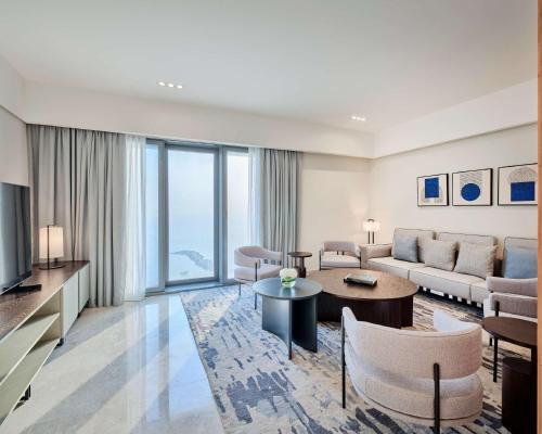 a living room with a couch and a table at Grand Hyatt Kuwait Residences in Kuwait