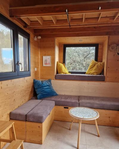 a room with a couch in a tiny house at Tiny House Loul Algarve no1 in Loulé