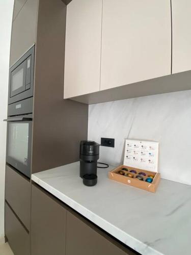 a kitchen with a counter top with a box of donuts at Luxury apartment with jacuzzi in Podstrana