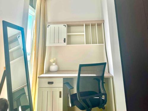 a chair sitting at a desk in a room at Sea View - 2BHK - Al Reem Island 6ppl Free Transportation from AD Airport in Abu Dhabi