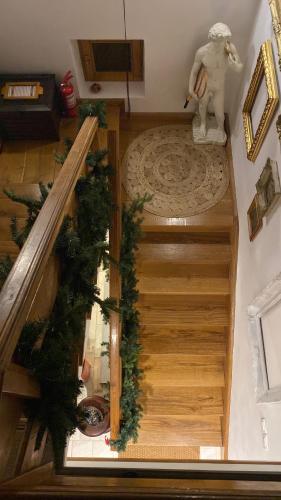 an overhead view of a staircase with christmas decorations at Bohemian Chalet in Buşteni