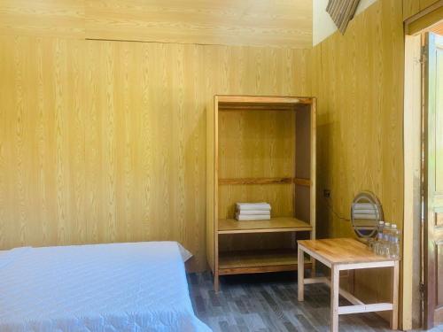 سرير أو أسرّة في غرفة في Green homestay Mai chau