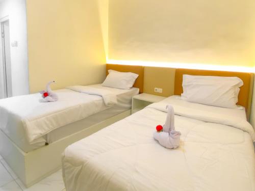Кровать или кровати в номере Nooris Inn Guest House