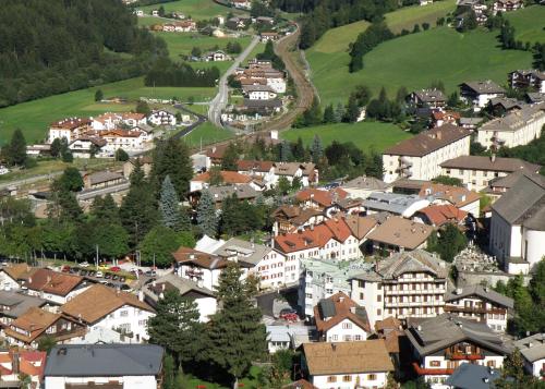 an aerial view of a town with houses and trees at Gasthof Moarwirt in Colle Isarco