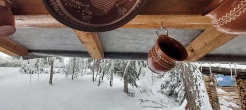 a chandelier with icicles hanging from a roof at Cottage Tatry so saunou in Tatranska Strba
