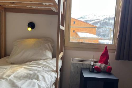 En eller flere senge i et værelse på Refuge des Vues Alpines Isola 2000
