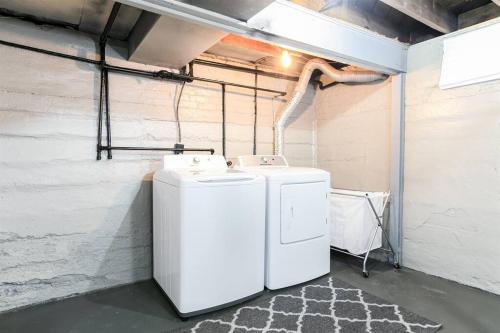 a washer and dryer in a room at South Bend Serenity: Freshly Renovated 3BR 2mi ND in South Bend