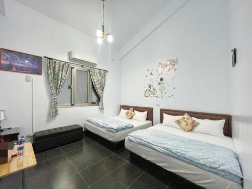 Llit o llits en una habitació de Jinlun Yufeng Homestay