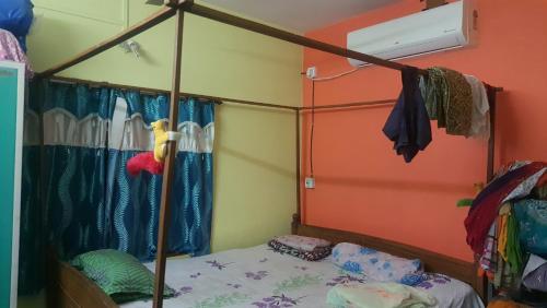 a bedroom with a canopy bed in a room at Amullya Kanan Villa in Haldia