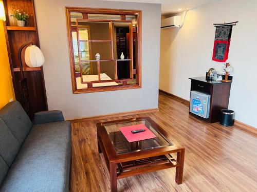 a living room with a couch and a table at Cat Cat View Hotel in Sa Pa