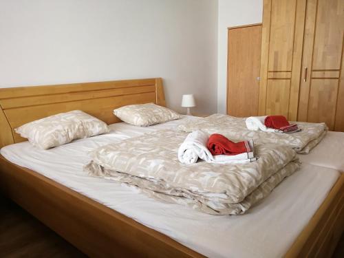 a bedroom with two beds with towels on them at Monte Rosa Apartments Täsch in Täsch