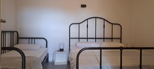 Apartments Tomina tesisinde bir odada yatak veya yataklar