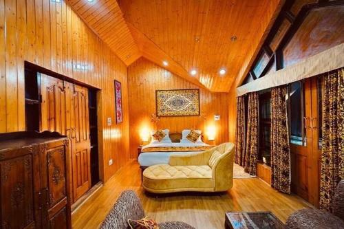 Llit o llits en una habitació de Sojourn Cottages Pahalgam