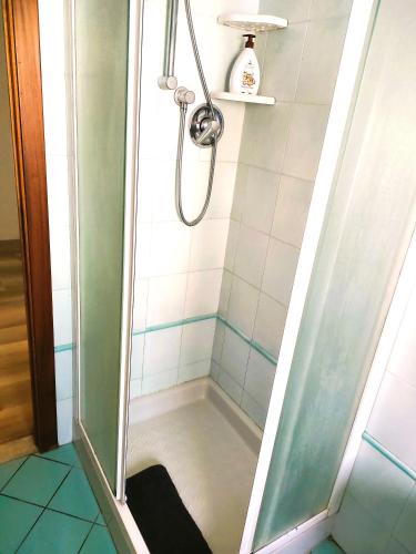a shower with a glass door in a bathroom at Appartamento Gioia Lugo a 5m da Maria Cecilia Hospital in Lugo