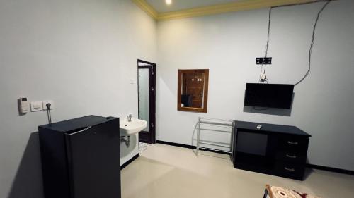 Televisi dan/atau pusat hiburan di Setiya Homestay