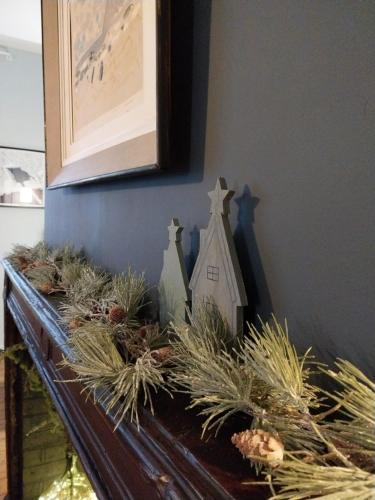 a table with christmas decorations on top of it at La Cabane du Pecheur in Honfleur