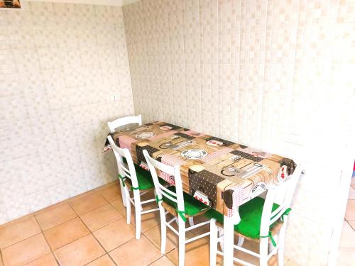 a table in a room with a table and chairs at Appartamento Il Sorriso Lugo piano terra a 5m da Maria Cecilia Hospital in Lugo