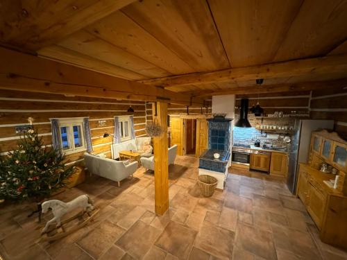 a large kitchen with a tub and a stove at Boutique Cottage Tkalcovna in Rokytnice nad Jizerou