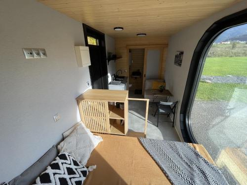 a tiny house with a room with a window at Tatry Panorama House in Zuberec