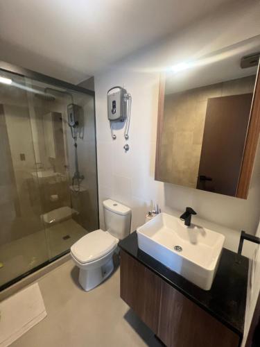 a bathroom with a sink and a toilet and a shower at SCZ Apartment 1 Bedroom Suite Beautiful view in Santa Cruz de la Sierra