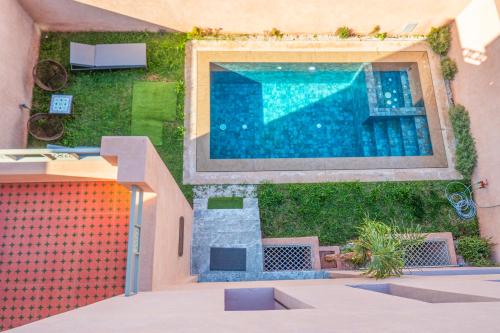 an overhead view of a swimming pool in a house at Villa Boutique Amani in Marrakesh