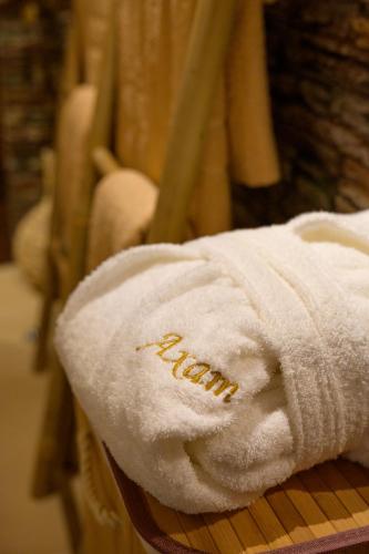 a towel with the word faith on it sitting on a chair at Ахат- къща за гости in Kyustendil