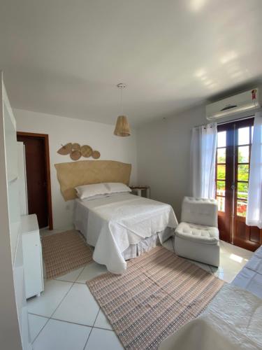 Säng eller sängar i ett rum på Quintal da Casa