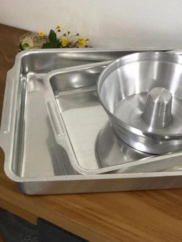 a stainless steel sink with a bowl in it at Faith Home 3 in Arraial do Cabo