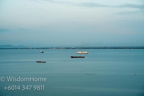 a large body of water with boats in it at Seaview Mansion One Georgetown in George Town