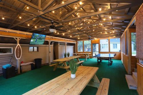 a large room with a ping pong table and a ping pong table at Spacious Pickleball Pines in South Haven