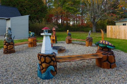 a playground with many different types of play equipment at Spacious Pickleball Pines in South Haven