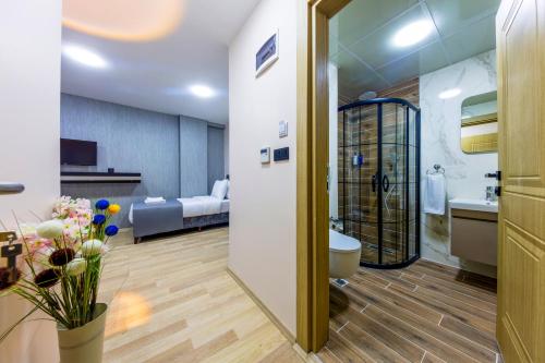 a bathroom with a sink and a toilet in a room at The Business Class Hotel in Istanbul