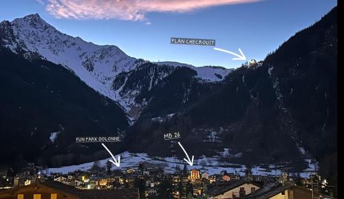 a view of a town in a mountain valley at MB26 in Courmayeur