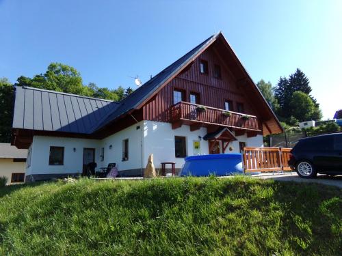 a house with a red and white at Apartment Nedrik in Rokytnice nad Jizerou