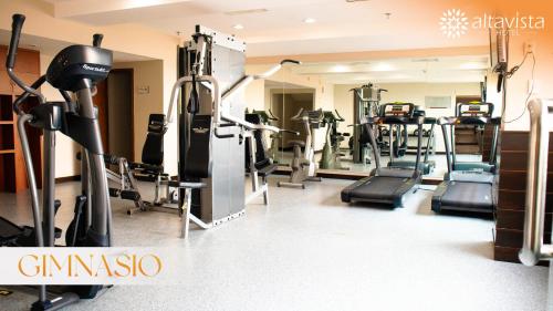 a gym with treadmills and elliptical machines at Altavista Hotel in Reynosa