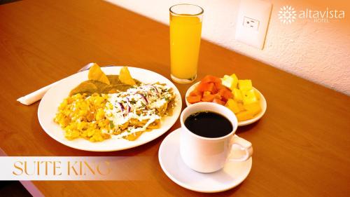 a table with two plates of food and a cup of coffee at Altavista Hotel in Reynosa