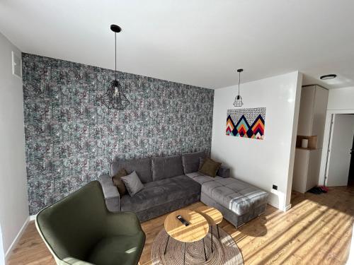 a living room with a couch and a table at GO Jahorina by Olympic Gardens in Jahorina