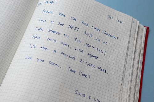 a notebook with handwriting on the pages at Pyjamagetaways in London
