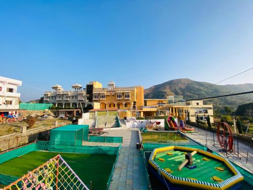 a water park with a person playing on a trampoline at Hotel Treasure OF Kumbhalgarh in Kumbhalgarh